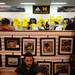 Fans wait in a line wrapped around the the second floor of the M Den in order to meet Michigan football star Desmond Howard during an autograph signing at the M Den on Friday.  Melanie Maxwell I AnnArbor.com